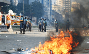 Bangladesh’s opposition supporters clash with police ahead of general election